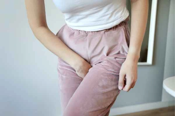 woman running for the toilet because of urinary incontinence Ledbury